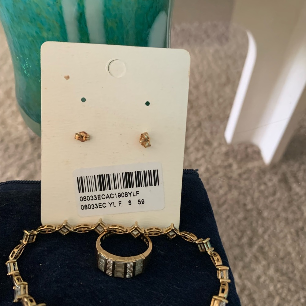 Heart shaped diamond earrings, a ring, and a bracelet